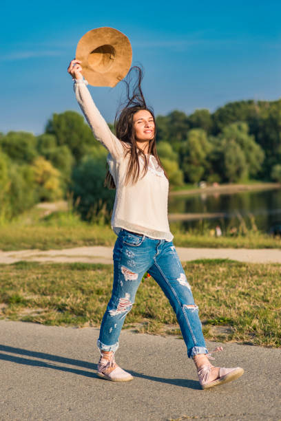 istock Young woman walking cheerful and relaxed by the river 689281040