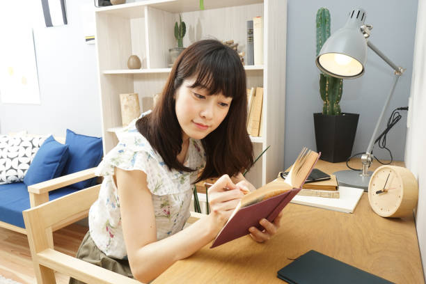 istock Young woman studying at home 689281526