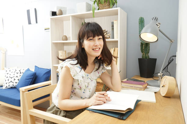 istock Young woman studying at home 689281560