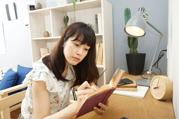 istock Young woman studying at home 689281580