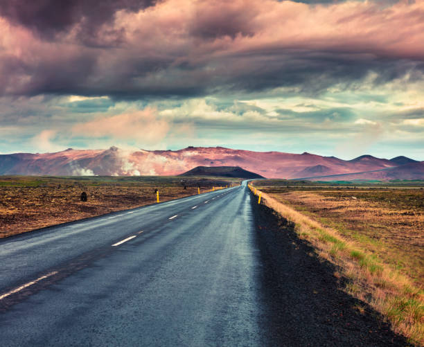 istock Empty asphalt road with colorful cloudy sky. 689284024