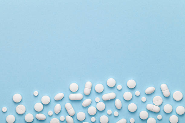 istock Medical Pills on Blue Background 689285150