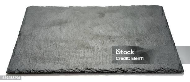 Rectangular Black Textured Slate Board For Dishes Isolated On White Background Side Angle View With Perspective Stock Photo - Download Image Now