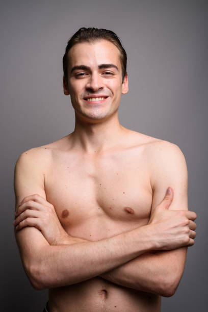 istock Studio shot of young man shirtless against gray background 689295194