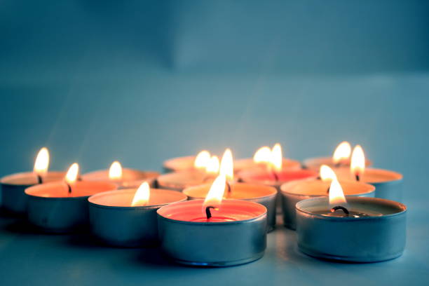 istock Glowing Candles in the Blue background 689297810