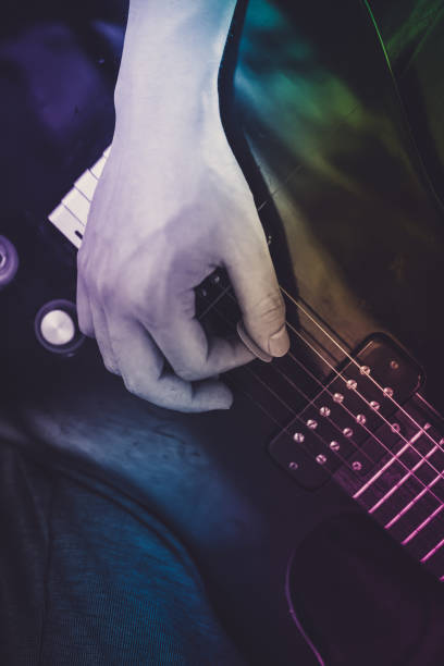istock Close up of a man playing electric guitar 689298232