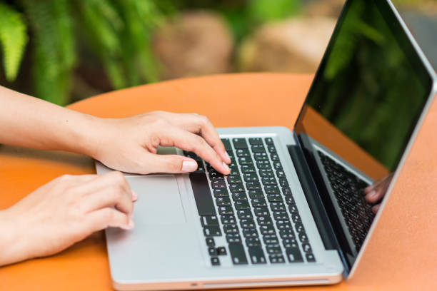 istock Woman hands typing on laptop 689298422