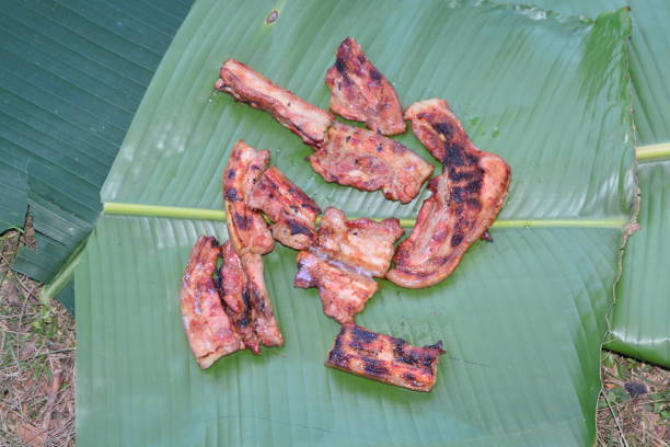 istock roast pork on banana leaf 689313718