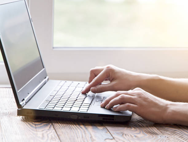istock Woman working at home office hand on keyboard close up 689316416