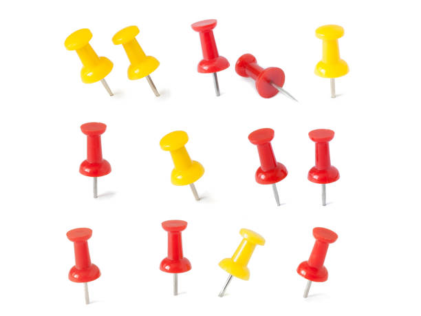 istock isolated red and yellow push pins in white background 689317890