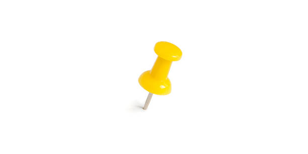 istock isolated yellow push pins in white background 689317908