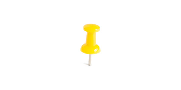 isolated yellow push pins in white background