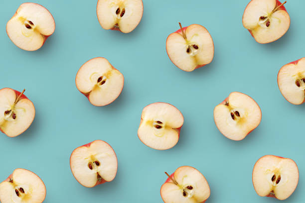 istock Apple slices pattern on a blue background. Repetition concept. Top view. Flat lay 689320238