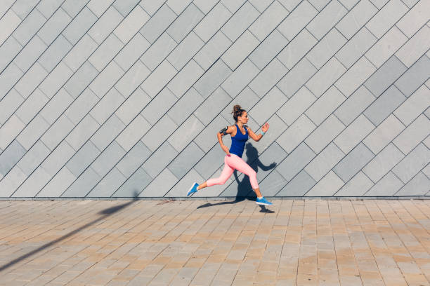 istock Sportswoman jogging 689320374