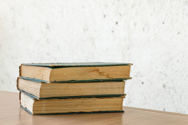 istock Bunch of vintage books on wooden table 689320708