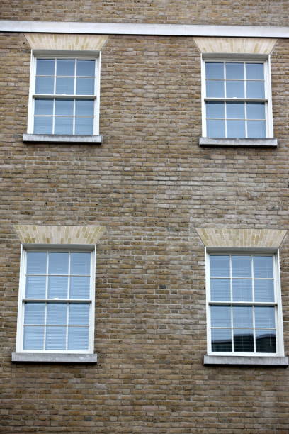 istock Georgian windows architecture on a wall house, London, UK 689323284