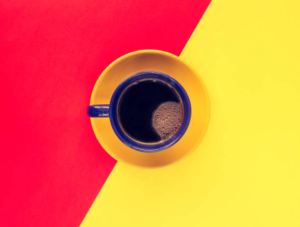 istock Blue cup of coffee on a colorful pastel background. 689323552