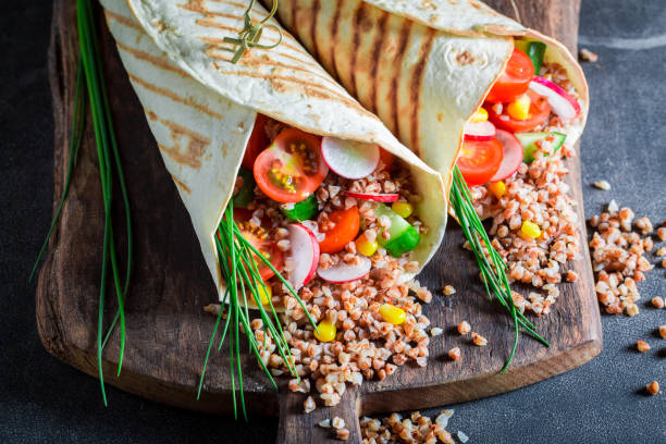 istock Tasty vegetarian tortilla with groats, chive and cherry tomatoes 689331082