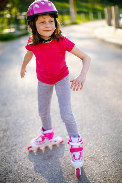 istock Beautiful little girl rollerskating 689331644