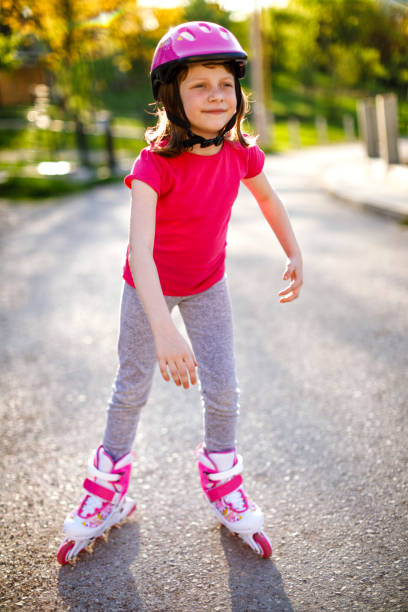 istock Beautiful little girl rollerskating 689331652