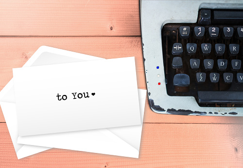 To you, love letter text on envelop stack letters with vintage typewriter