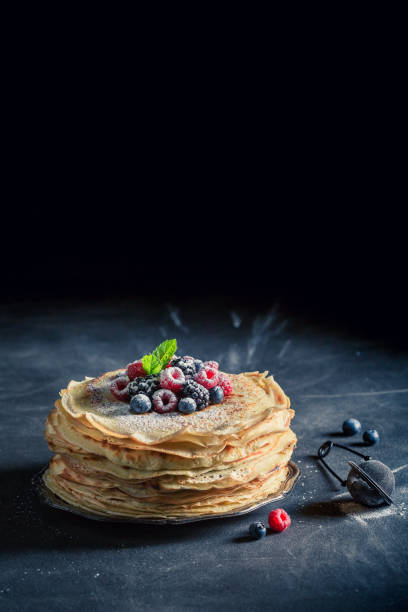 istock Tasty pancakes cake with blueberries and raspberries 689335122