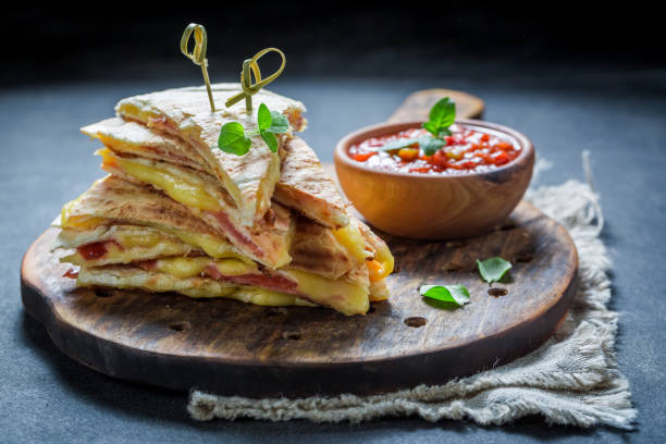 istock Hot tortilla as quesadilla with cheese and ham 689335286