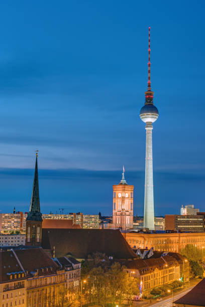 istock Television Tower and townhall at night 689350740