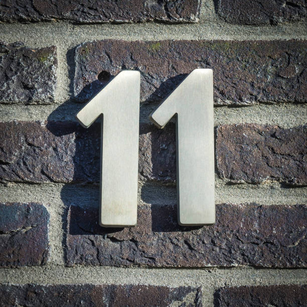 No. 11 stainless steel house number eleven, agains a brick wall bowie seamount stock pictures, royalty-free photos & images