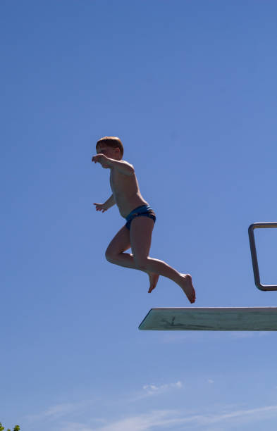 istock Young boy in the outdoor pool 689366560