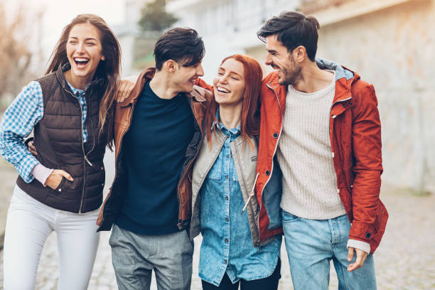 istock Cheerful friends having good time outdoors 689366704