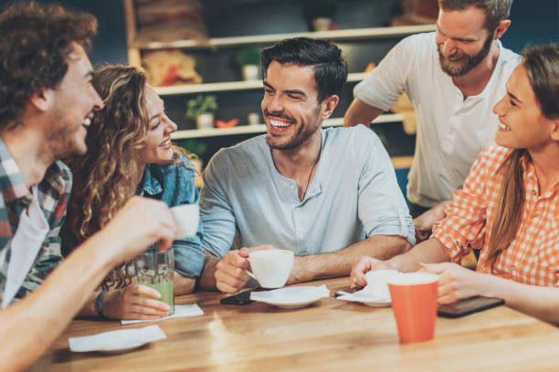 istock Group of happy friends in cafe 689366722