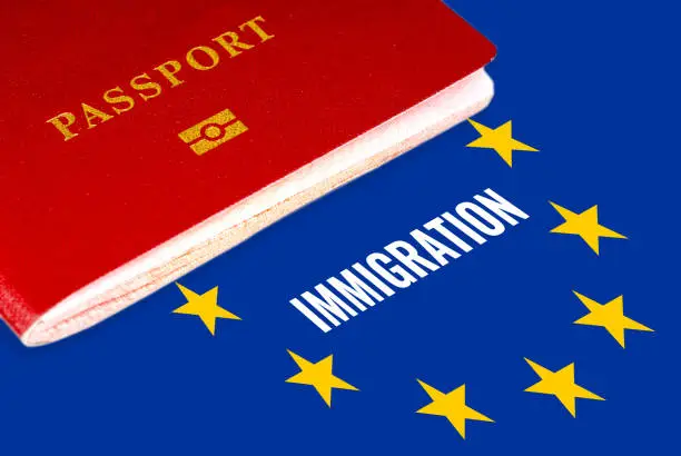 immigration, white text over eu flag and passport