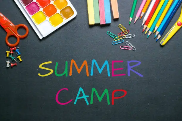 summer camp colorful chalk text on blackboard