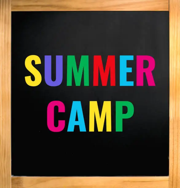 summer camp colorful text on blackboard