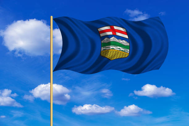 istock Flag of Alberta waving on blue sky background 689380660