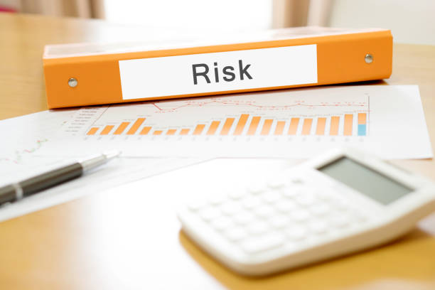 istock Orange  binder debtor on desk in the office with calculator and pen 689386492