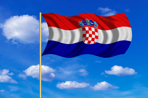 istock Flag of Croatia waving on blue sky background 689394624