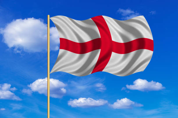 istock Flag of England waving on blue sky background 689397700