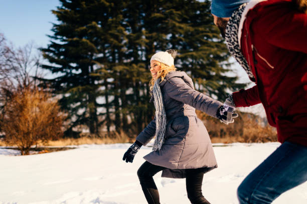 istock Mid Adult Couple Having Fun Outdoors At Winter 689398674