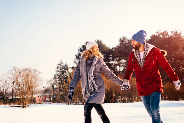 istock Mid Adult Couple Having Fun Outdoors At Winter 689398682