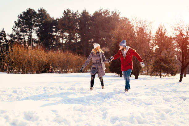 istock Mid Adult Couple Having Fun Outdoors At Winter 689399036