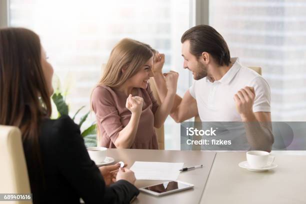 Funny Young Couple Enjoying Buying Own Apartment We Did It Stock Photo - Download Image Now