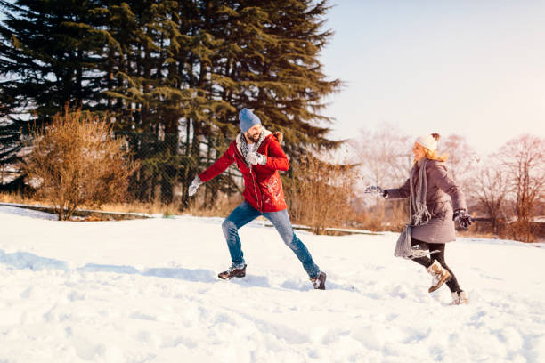 istock Mid Adult Couple Having Fun Outdoors At Winter 689401714