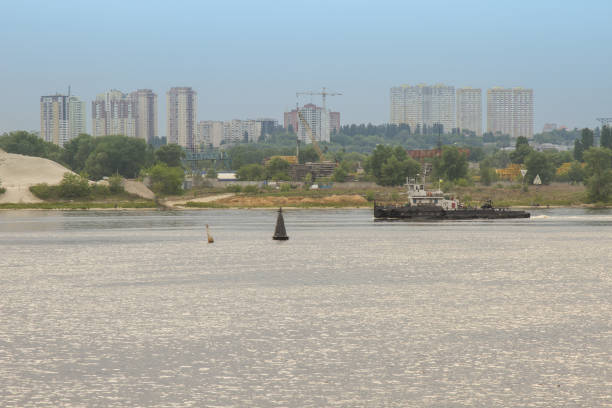 istock On the river Dnieper is a tugboat 689413866