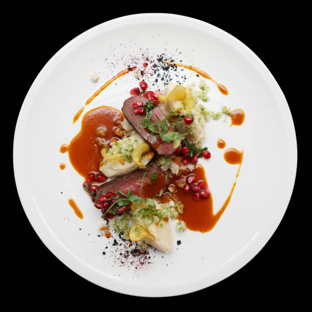 istock Venison fillet and potato puree isolated on black 689417312