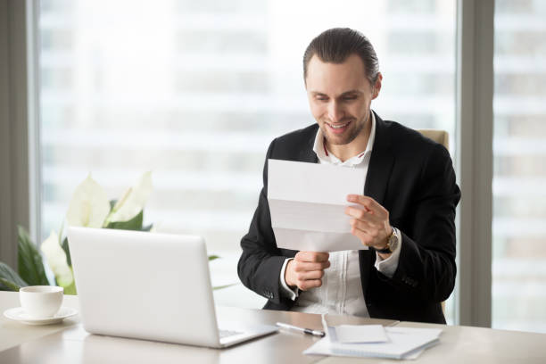 istock Office worker gets pay raise, premium or bonus 689425474