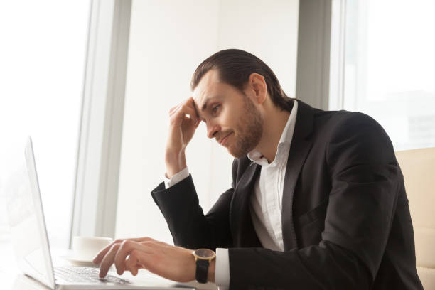 istock Businessman tired from routine work on laptop 689425560