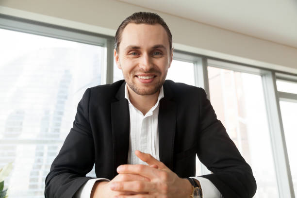 istock Smiling entrepreneur is negotiating with partners 689425630