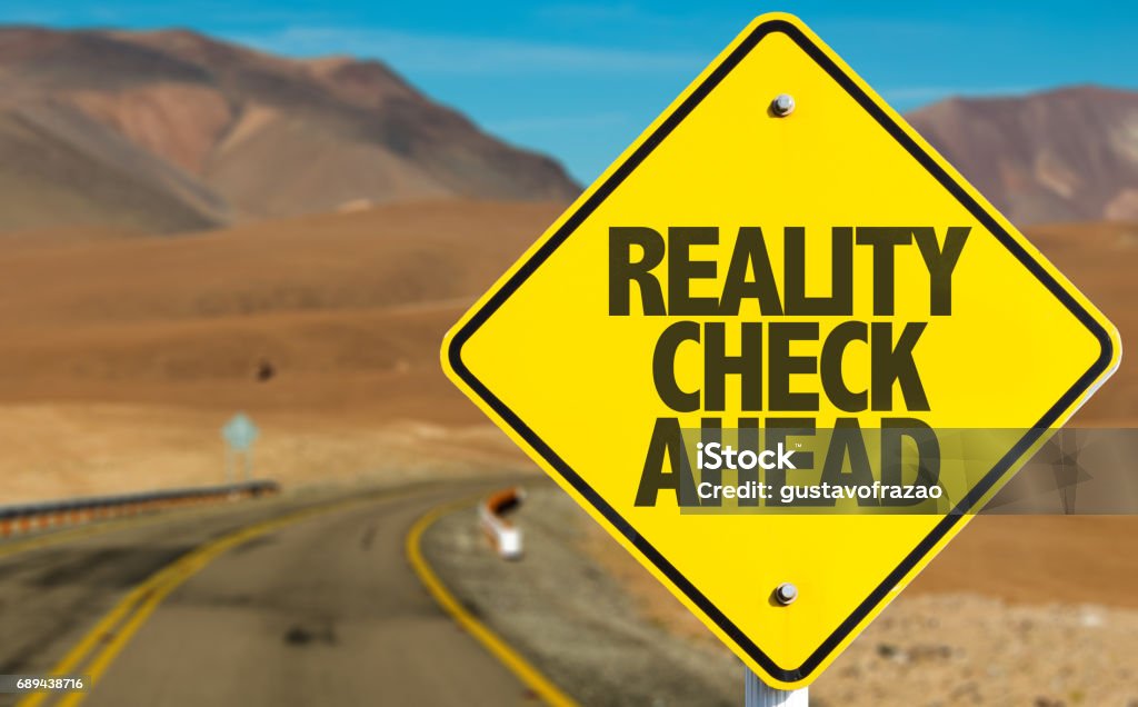 Reality Check Ahead Reality Check Ahead sign on desert road Mythology Stock Photo